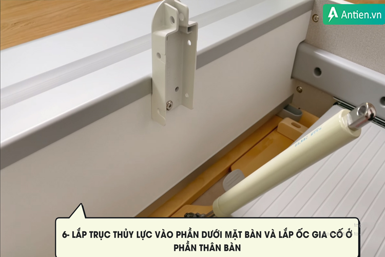 Lắp trục thủy lực trên bàn học QM120H để nâng hạ độ nghiêng